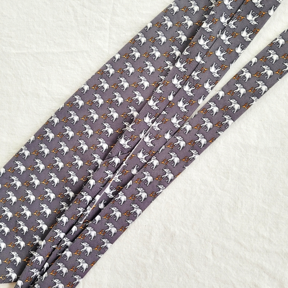 Kai Long handmade 100% silk classic men's tie. Grey, repeating elephant print